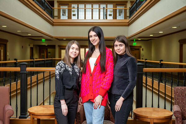 Three Ukrainian Catholic University students, from left, Vitaliia Mahas, Adriana Hrytsyna, and Solomiia Humen.