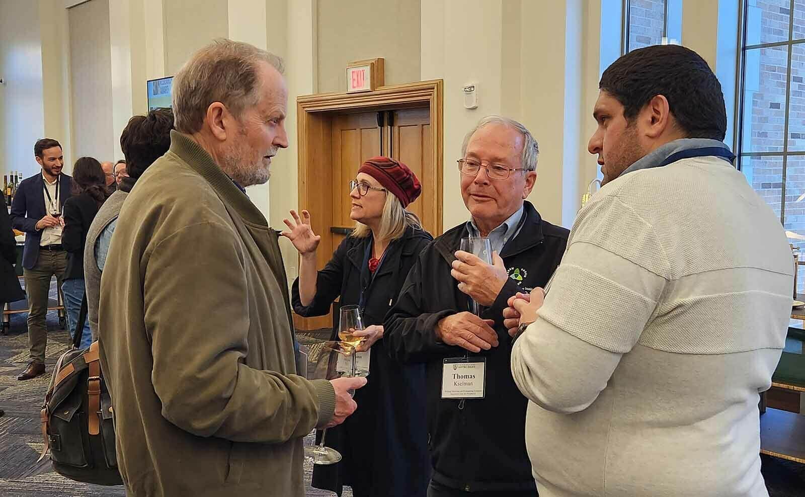 Peter Gatrell speaks with panelist Jean-Pierre Gauci and conference participant Thomas Kselman, professor emeritus in the Notre Dame department of history.