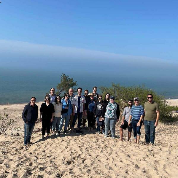 Group photo at Indiana Dunes State Park on the shore of Lake Michigan.