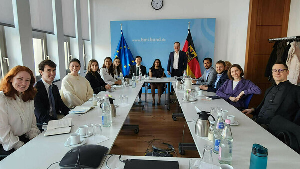 Students at a table at the BMI office in Berlin.
