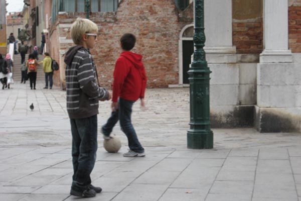 Children playing soccer in Venice, Italy