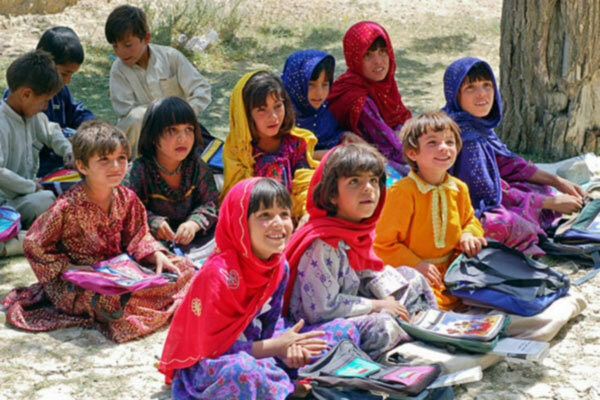 Schoolgirls sit in the girls' section of a school in Bamozai, near Gardez, Paktya Province, Afghanistan by Capt. John Severns, U.S. Air Force, public domain