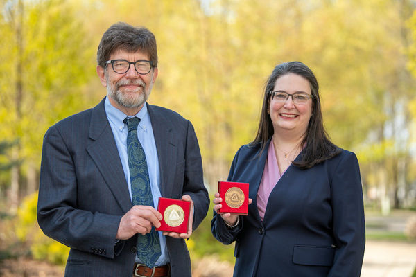 A. James McAdams and Monica Caro with their medals from the Catholic University in Ružomberok, Slovakia