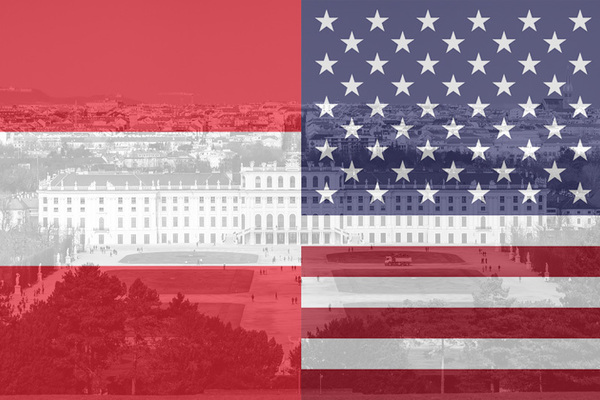 Austria and U.S. flags overlaid  a photo of the Schönbrunn Palace in Vienna.