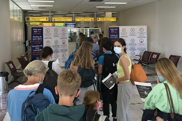 Passengers at an airport in Europe during the COVID-19 pandemic.