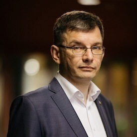 Headshot of Rector Taras Dobko, who is wearing glasses and a suit.
