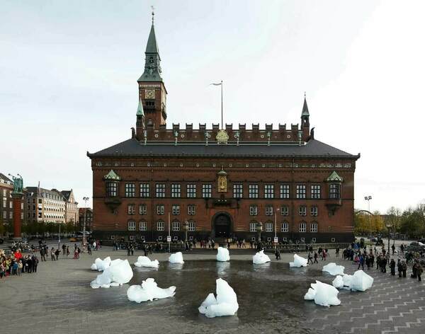 Copenhagen City Hall with icebergs displayed in the square.